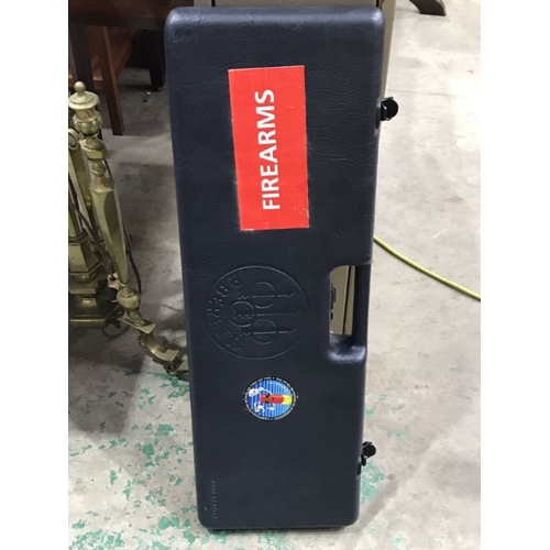 833 - A metal gun safe, single key and removable door, 135cm high together with a P Beretta gun moulded sh... 