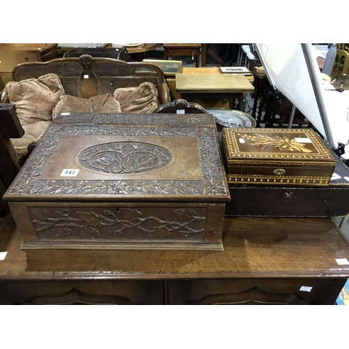 843 - A carved oak bible box, dated 1893, the sloping lid with  foliate and floral border above  grape and... 