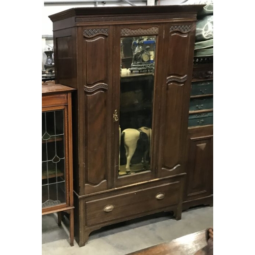 865 - An Edwardian mahogany single mirror door wardrobe,  fitted long drawer to base