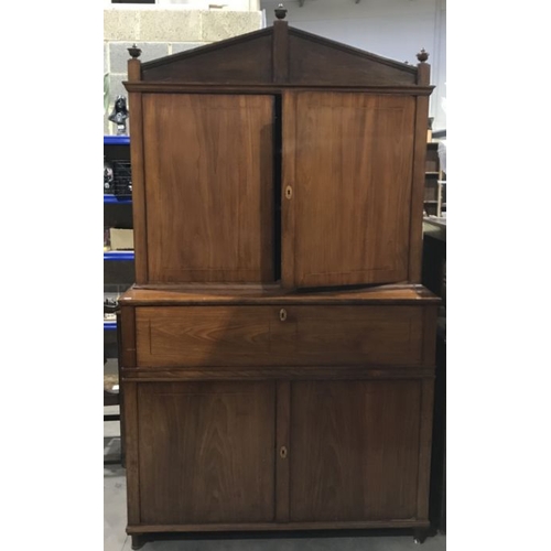 868 - A George III mahogany, boxwood and ebony strung secretaire bookcase, angled pediment flanked by urn ... 