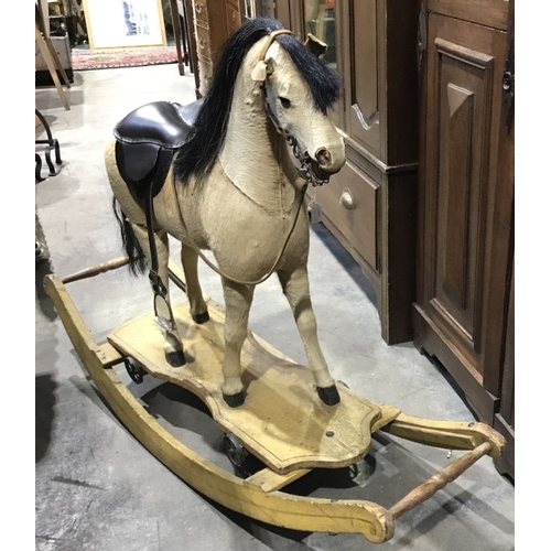 870 - An antique German style rocking horse, horse hair, carved and stuffed body, carved and painted open ... 