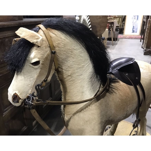 870 - An antique German style rocking horse, horse hair, carved and stuffed body, carved and painted open ... 