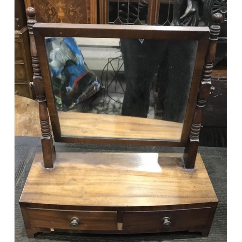 877 - A George III mahogany swing framed toilet mirror, the bow front base fitted two drawers, 44cm wide