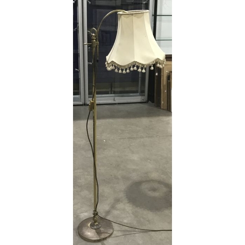 885 - A brass library lamp and a Brass standard lamp, with vase knopped column and a brass floorstanding r... 