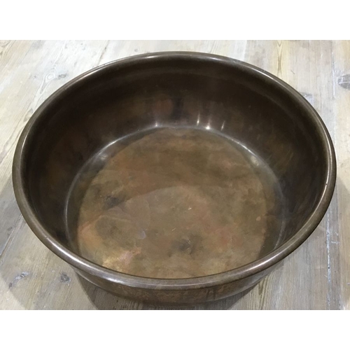 886 - A circular copper bowl, 41cm diameter