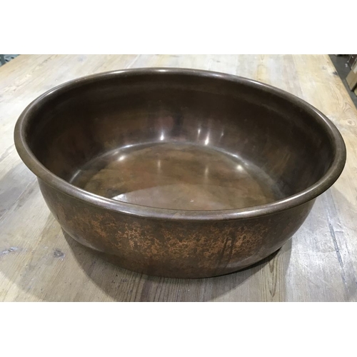 886 - A circular copper bowl, 41cm diameter