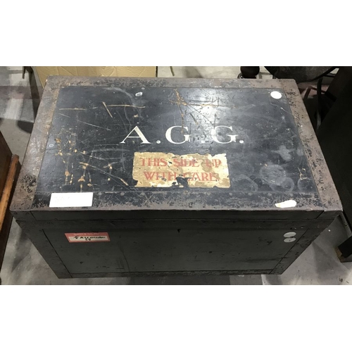 894 - A metal bound painted wooden trunk, with painted monogram A G G, 73cm wide