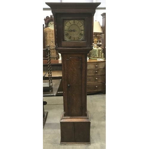 897 - An 18th Century oak longcase clock by Robert Pikthall, the brass dial with moulded spandrels and bra... 