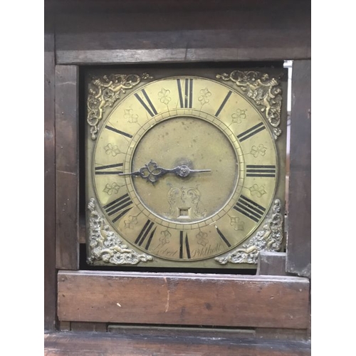 897 - An 18th Century oak longcase clock by Robert Pikthall, the brass dial with moulded spandrels and bra... 