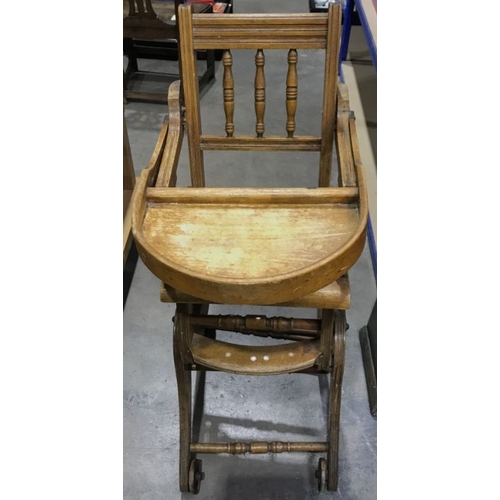 901 - An Edwardian oak child's high chair, bobbin turned back rail, on adjustable base and wheels