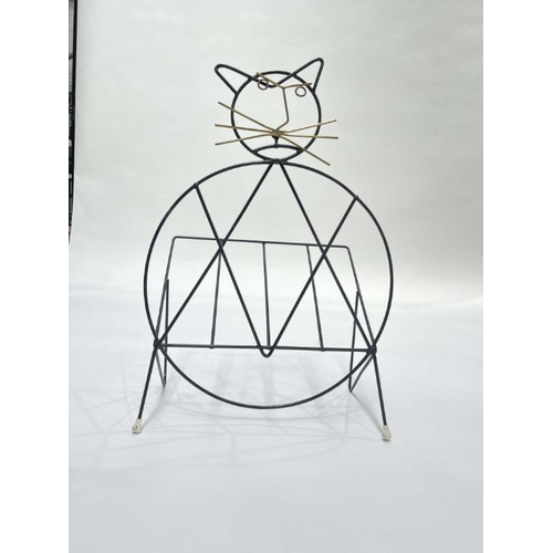 904 - Richard Galef for Ravenware,  a cat magazine rack, circa 1950s, black lacquered wire and brass facia... 