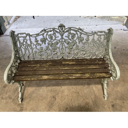 912 - A Victorian cast iron garden bench, in the manner of Coalbrookdale, fruiting vine design, downswept ... 