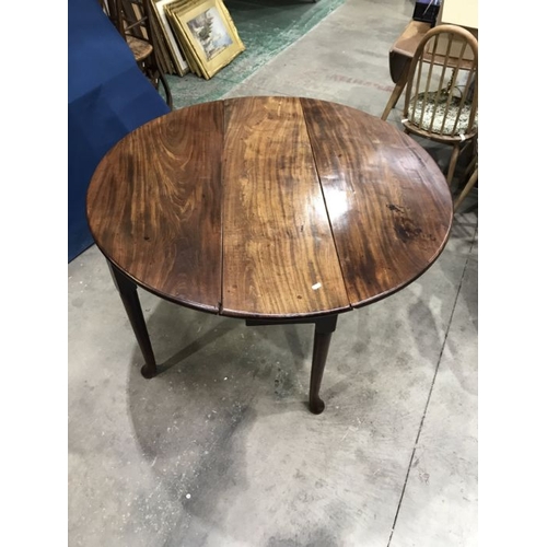 915 - A George III style mahogany circular drop flap table, 122cm maximum width