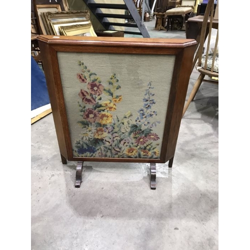 917 - A tapestry firescreen, 64cm wide together with two tier tea trolley, 27cm wide (2)