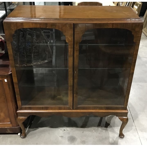 922 - A mahogany vitrine, circa 1930's, moulded top, cabriole legs, pad feet, 132cm high, 106cm wide, 40cm... 