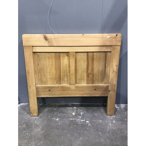 925 - An oak panelled headboard. 98cm wide