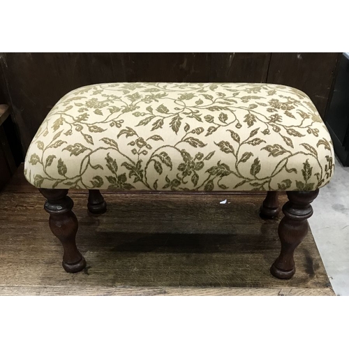 933 - A rectangular upholstered footstool, on baluster turned legs, 60cm wide