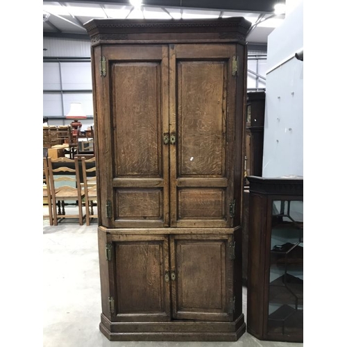 935 - A George III country oak corner standing corner cupboard, circa 1770, Greek key cornice, Chinese bli... 