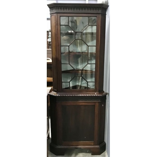 936 - A George III mahogany corner standing cupboard, circa 1800, the upper section with moulded frieze, c... 