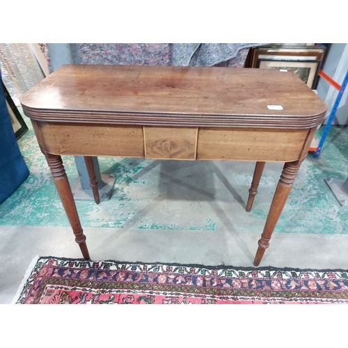 937 - A Regency mahogany tea table, circa 1810, fold-over top with reeded edge, gate leg action, strung fr... 