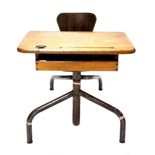 941 - A French child's school desk, early 20th Century, oak top with ink pot hole, pen well and shelf belo... 