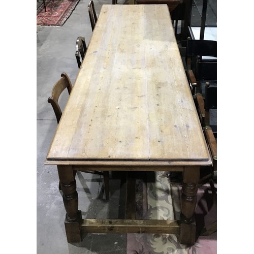 942 - A large traditional pine refectory table, stripped pine top with moulded edge, baluster turned legs,... 