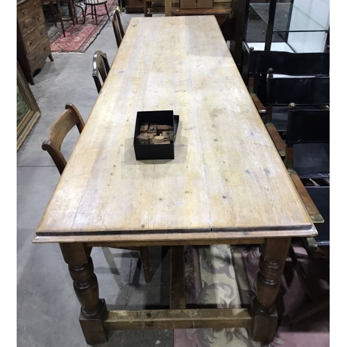 942 - A large traditional pine refectory table, stripped pine top with moulded edge, baluster turned legs,... 