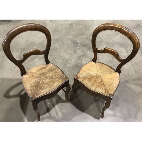 944 - A pair of 19th Century balloon back dining chairs, woven cane seats with serpentine front rails, Fre... 