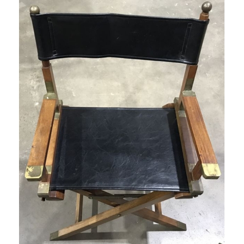 946 - A set of three hardwood Directors type folding armchairs, brass fittings, black leather seats and ba... 