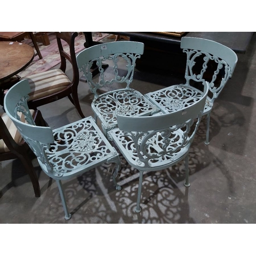 948 - A set of four cast alloy garden dining chairs, of Victorian style with vine design (4)