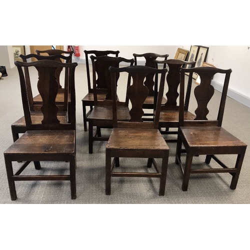 952 - A set of nine Country oak Chippendale style dining chairs, with panelled seat and carved splat  (9)