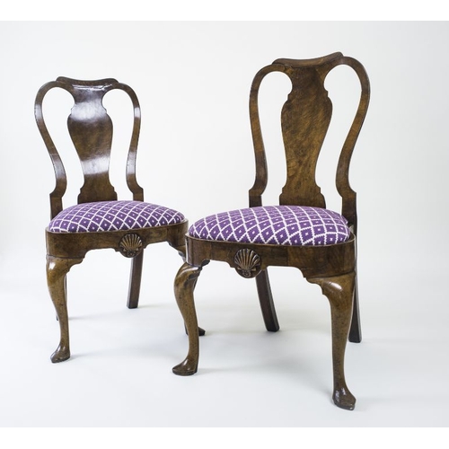 953 - A pair of early George II walnut side chairs, circa 1730, moulded top rails, pierced backs with vase... 