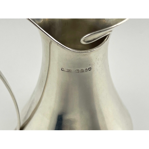 204 - A Jugendstil silver jug, import marks Murrle Bennett and Co., London 1903, splayed baluster form wit... 