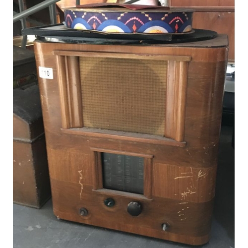 110 - A quantity of metal toolboxes, tins and wooden containers, together with a vintage radio