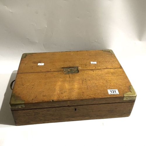 131 - A 20th century EPNS canteen set, velvet lined interior with two tiers, in oak case with brass corner... 