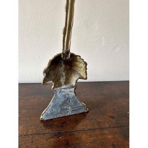 193 - A weighted brass wheatsheaf pattern door stop, 41cm high