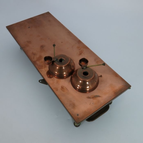 197 - An Arts and Crafts copper and brass plate warmer, circa 1900, two tiers with a pair of burners, on o... 