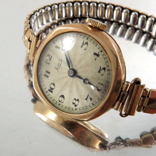 266 - Linit, a ladies 9 carat gold wrist watch, engine turned silvered dial with Arabic numerals, on plate... 