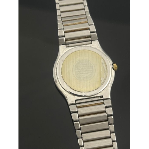 272 - A Mido steel and gilt ladies wristwatch, tricolour gold stripe dial with date window, quartz movemen... 