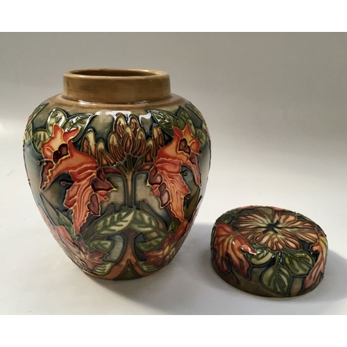 327 - A Moorcroft ginger jar and cover, 16cm high