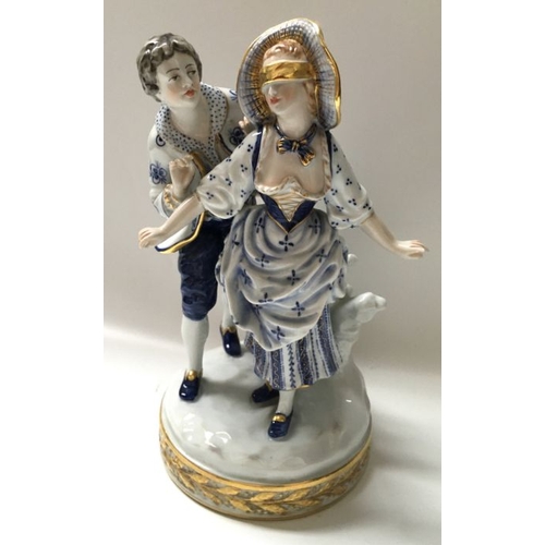 359 - A Capodimonte figure group, Blind Man's Buff, modelled as an 18th century lady with blindfold and co... 