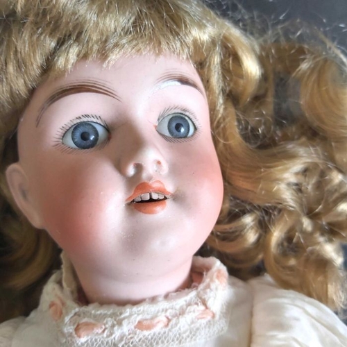 396 - Max Handwerck bisque head doll, fixed blue eyes, painted open mouth and exposed teeth, composite joi... 