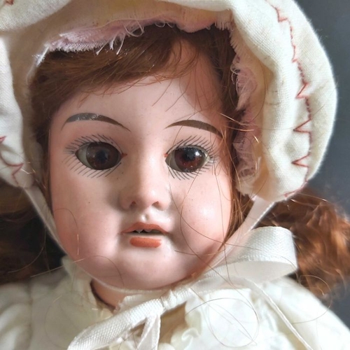 404 - Armand Marseille bisque head doll, fixed brown eyes, painted open mouth and exposed teeth, composite... 