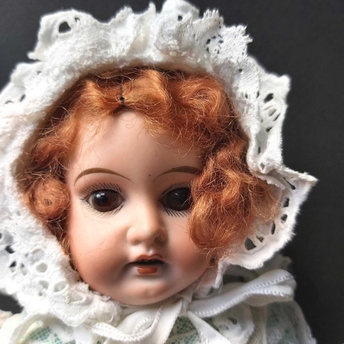 405 - Armand Marseille bisque head doll, fixed brown eyes, painted open mouth and exposed teeth, jointed k... 