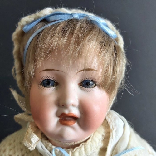 408 - A German baby bisque head doll, sleeping blue eyes, painted open mouth, painted eyebrows and eyelash... 