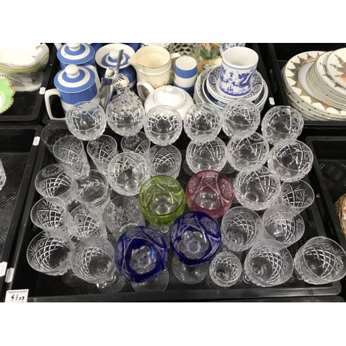 41 - A quantity of cut glass, including Stuart style decanters, flash cut hock glasses, goblets, tumblers... 