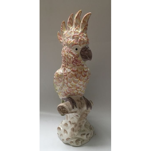 424 - An Italian majolica bird figure, modelled as a parakeet on tree stump base, printed mark GBC, 45.5cm... 