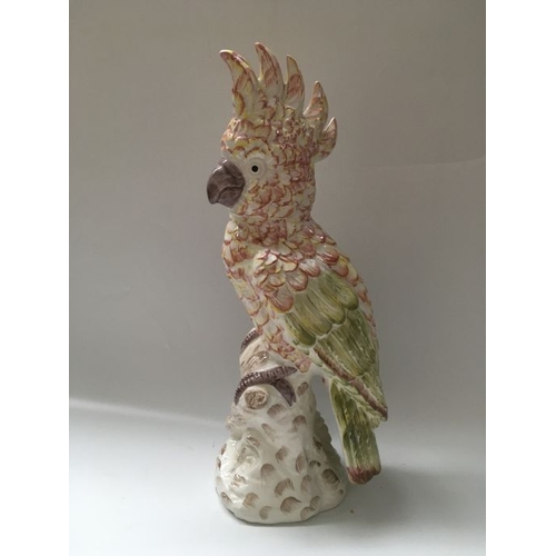 424 - An Italian majolica bird figure, modelled as a parakeet on tree stump base, printed mark GBC, 45.5cm... 