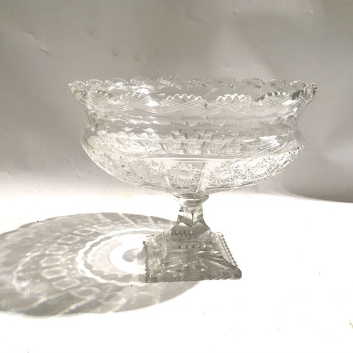 427 - A cut glass pedestal bowl, hobnail and star cut decoration and castellated rim, and another example,... 