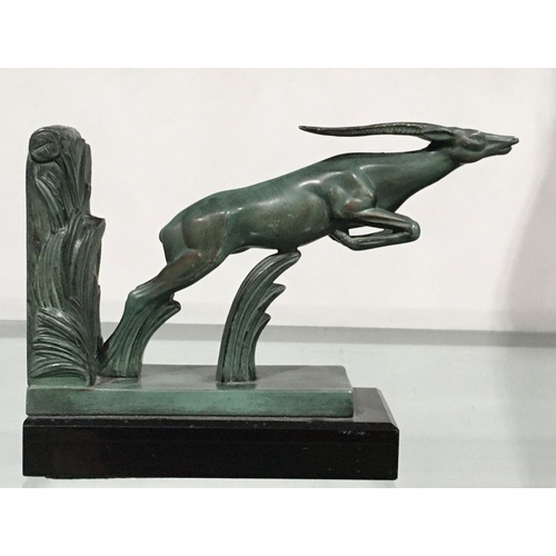 440 - Max Le Verrier, an Art Deco patinated art metal figural bookend, modelled as a leaping gazelle, 17cm... 